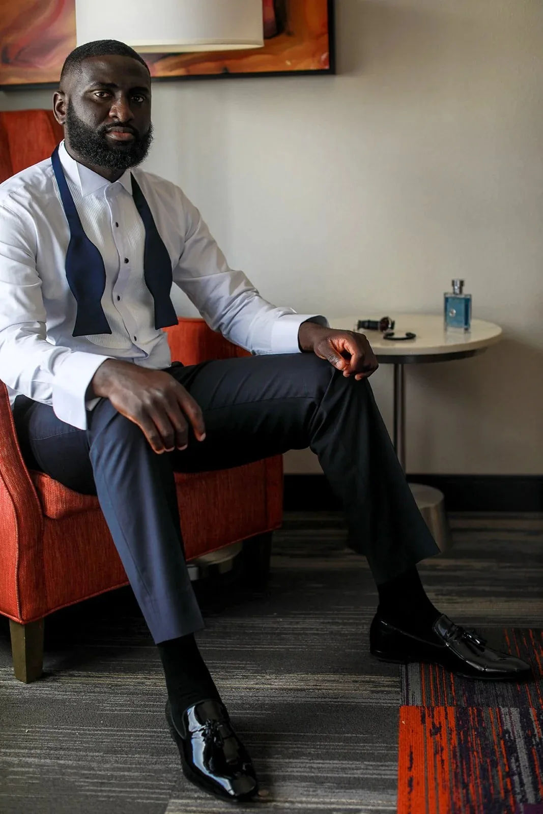 Groom seated before the event