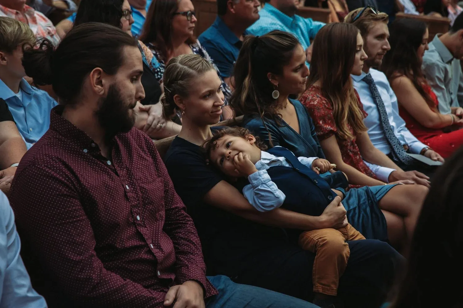 Family watching a event ceremony