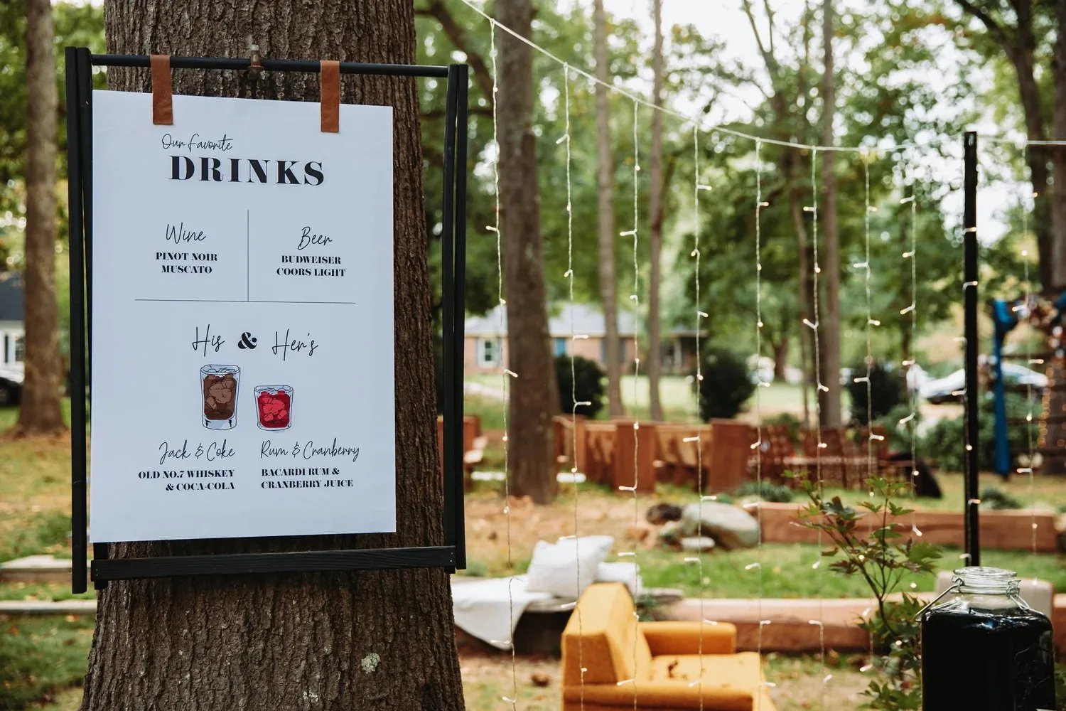 Outdoor event cocktail setting among tall trees