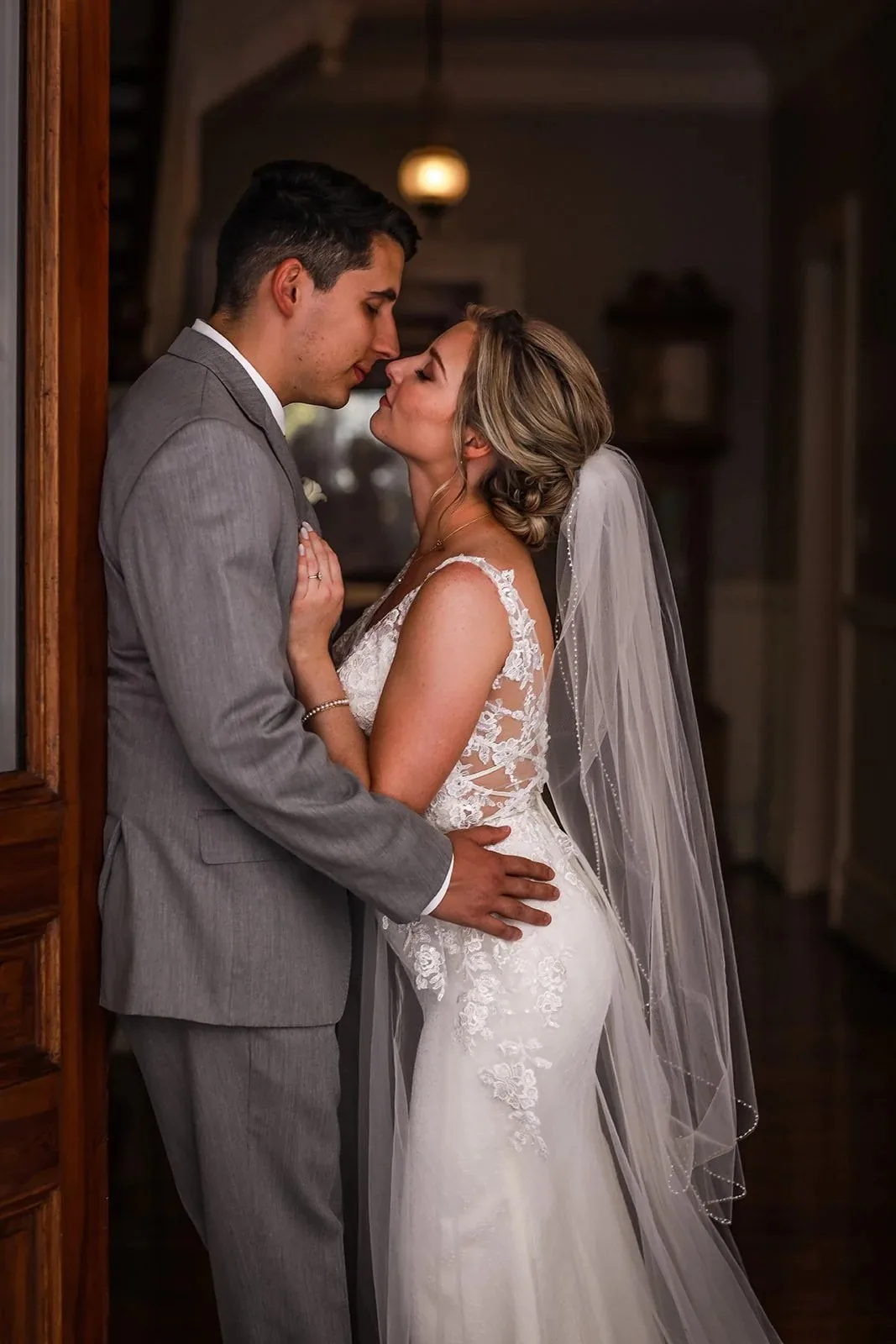 People sharing a quiet kiss after their ceremony